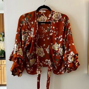 Orange floral wrap top